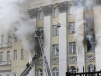 Firefighters work to extinguish a fire at the Russian Defence Ministry's building in central Moscow, Russia, April 3, 2016. REUTERS/Maxim Zmeyev